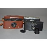 Three Purma Roll Film Cameras, two Purma Special Bakelite cameras, one with back taped on in maker's