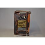 A Coin-Operated 'Kalloscop' Table-Top Stereoscopic Viewer, painted wood, circa 1910, P, case and