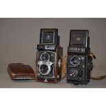 Two Yashica Mat Roll Film TLR Cameras, a Yashica-Mat 124 G, serial no 9080333, shutter working,