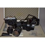 A Group of 35mm Cameras, Lenses and Accessories, including a Minolta X-300 SLR camera, winding lever