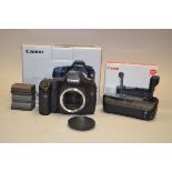 A Canon 5D DSLR Body, serial no 0930709568, condition G, shutter working, with battery grip BG-E4,
