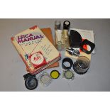 A Small Tray of Leica Literature and Accessories, including The Leica Manual (Morgan & Lester 1947),