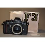 A Nikon F3 SLR Body, serial no 1443735, black, DE-2 eye-level pentaprism, shutter working, body G,