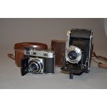 A Voigtländer Bessa I and a Kodak Retina IIIc Folding Cameras, a Bessa I with a Vaskar 105mm f/4.5