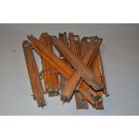 A Quantity of Individual Polished Wooden Legs, possibly easel or tripod legs with brass clamps and