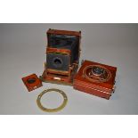 Two Thornton-Pickard Imperial Triple Extension Half Plate Cameras, one modified example with a