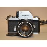 A Nikon F Photomic FTn SLR Camera, chrome, serial no 7213700, body F, brassing on side of lens