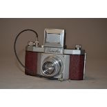 A Praktiflex 35mm SLR Camera serial no 2681, chrome body red leather, circa 1940 version without