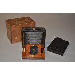 A No 1 Primus Wooden Folding Plate Camera, for 3"x 4" plates, brass mounted lens, external single