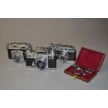 Three 35mm Rangefinder Cameras, a Zeiss Ikon Contax III, serial no E 35830, shutter stuck open,