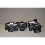 A Group of Rolleiflex SLR Cameras, including a black Rolleiflex SL35 with a Carl Zeiss Tele-Tessar