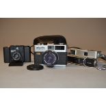 A Group of Compact Film Cameras, a Minolta Hi-Matic F rangefinder camera, serial no 1195453, with