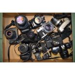 A Group of Japanese 35mm SLR Cameras, including Canon, Chinon, Konica, Minolta and Olympus plus a