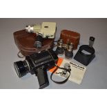 A Pair of Cine Cameras and Opera Glasses, a Minolta Zoom 8 Standard 8mm camera with owner's manual