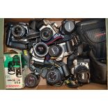 A Tray of Modern SLR Cameras, including Canon EF-M, Canon EOS 500N, Canon EOS 300D DSLR, Cosina