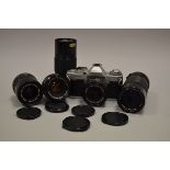 A Canon AV-1 SLR Camera and Canon Lenses, including AV-1 serial no 1513804 with FD 50mm f/1.8
