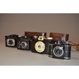 A Group of Bakelite Roll Film Cameras, a Whitehouse Beacon 3 x 4cm camera with maker's case, a Fex-