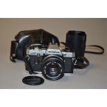 An Olympus OM10 SLR Camera and Accessories, serial no 259248, with Zuiko 50mm f/1.8 lens, maker's