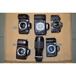 A Tray of Nikon 35mm SLR Bodies, a Nikon F100, a Nikon F80, a Nikon F70, a Nikon F60 together with a