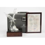 A Swarovski crystal limited edition model of 'The Eagle', no. 6447/10000, with wooden stand, and