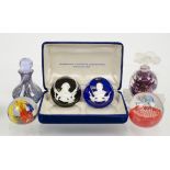 A collection of decorative glassware, comprising four paperweights including a Caithness example and