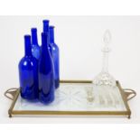 A miscellaneous collection of glass, comprising seven blue glass bottles including a John Harvey