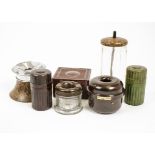 A large collection of inkwells and bottles, constructed of glass, bakelite and metal in a variety of