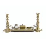 A group of brassware, comprising a brass twin-handled deskstand, single inkwell, 27.5 cm wide; and