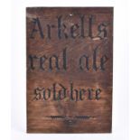 A vintage wooden pub sign advertising Arkell's Brewery, 'Arkells real ale sold here' in stencil,