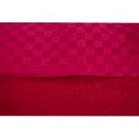 A large selection of red linen and textiles, including a Yvles Delorme duvet and pillow covers