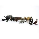 A collection of 20th Century lead zoo animals, including a Taylor & Barret camel, J Hill & Co