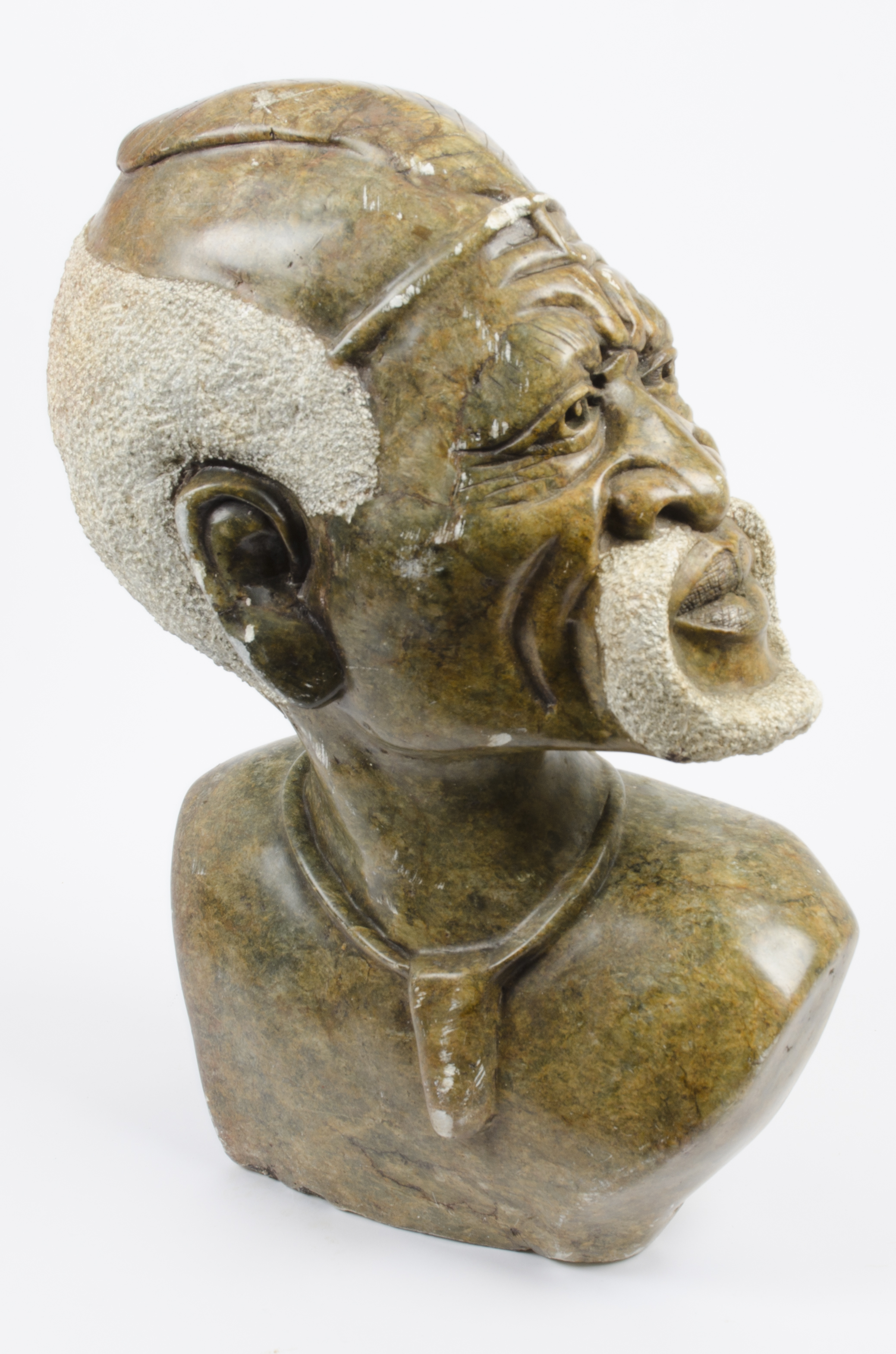 A large 20th Century African carved soapstone bust of a man with beard, 57 cm high