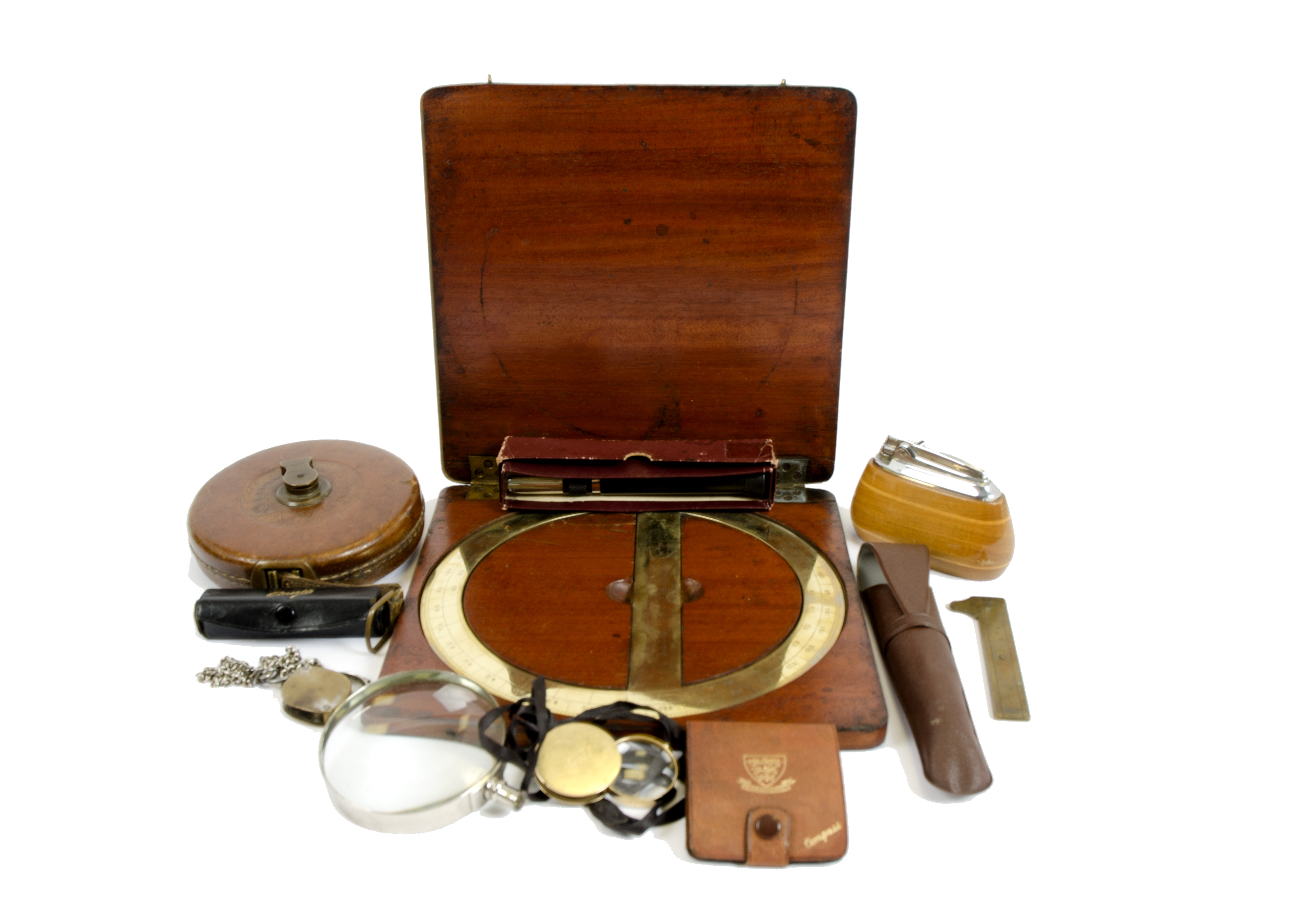 A miscellaneous collection, including a Newton & Co cased brass protractor, a vintage Ronson table