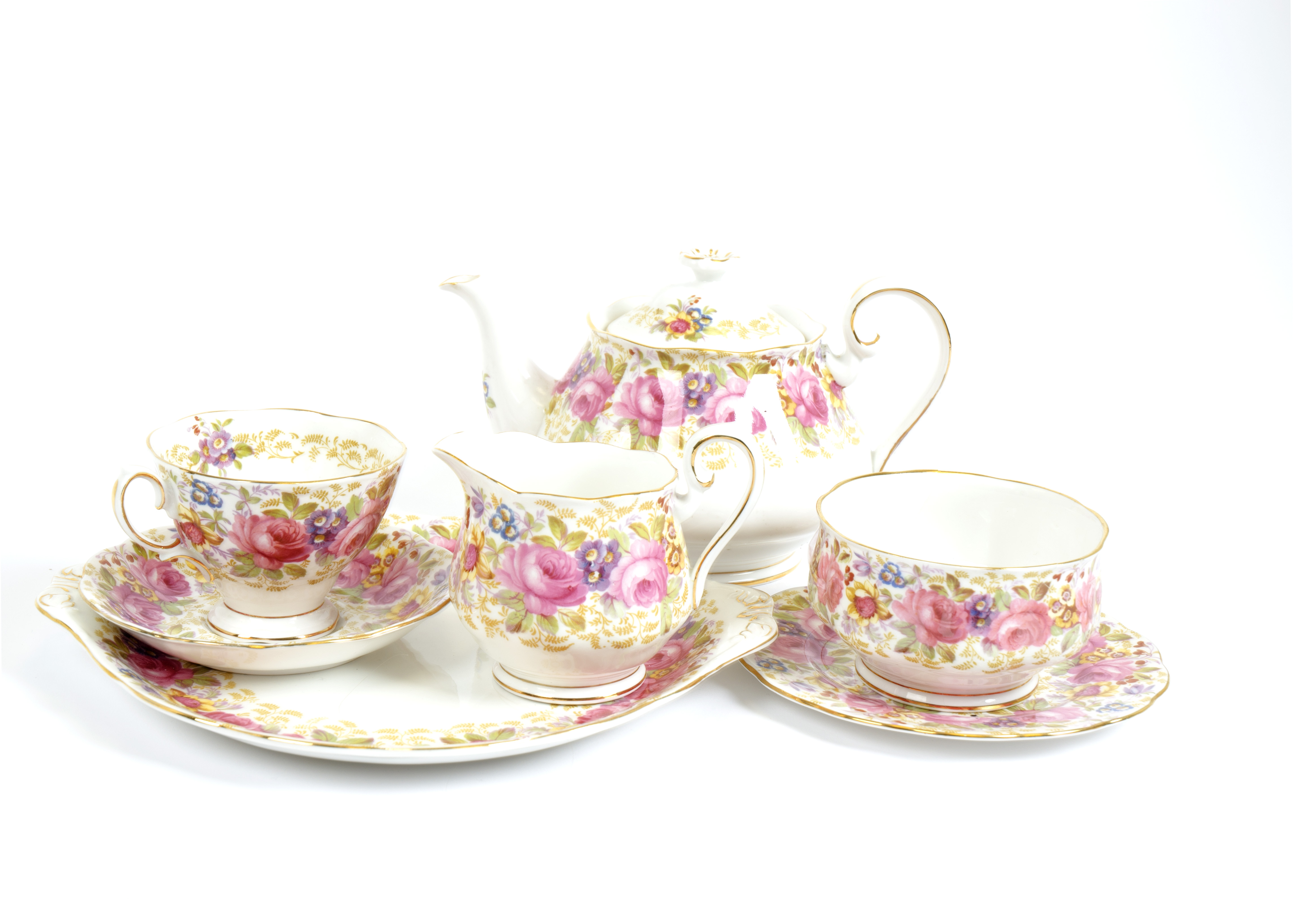 A Royal Albert 'Serena' pattern part tea set, including two teapots, two cream jugs, two sugar