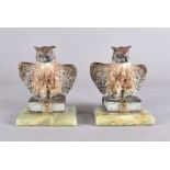 A pair of early 20th Century Viennese cold painted bronze owls, both modelled with wings slightly