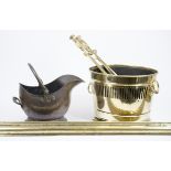 A collection of metalware, including a fireplace fender, two coal scuttles, poker, pair of tongs,