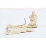 A 19th Century carving of a mythical beast, with scales and an entwined body, 10.5 cm length,