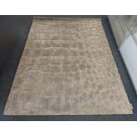 A Calvin Klein viscose rug, irregular raised grey panels on cream ground, 225 cm x 162 cm