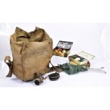 A collection of fishing related items, comprising four vintage cork-handled rods with bags including