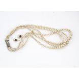 A vintage three strand cultured pearl necklace, with silver and marcasite clasp, together with a
