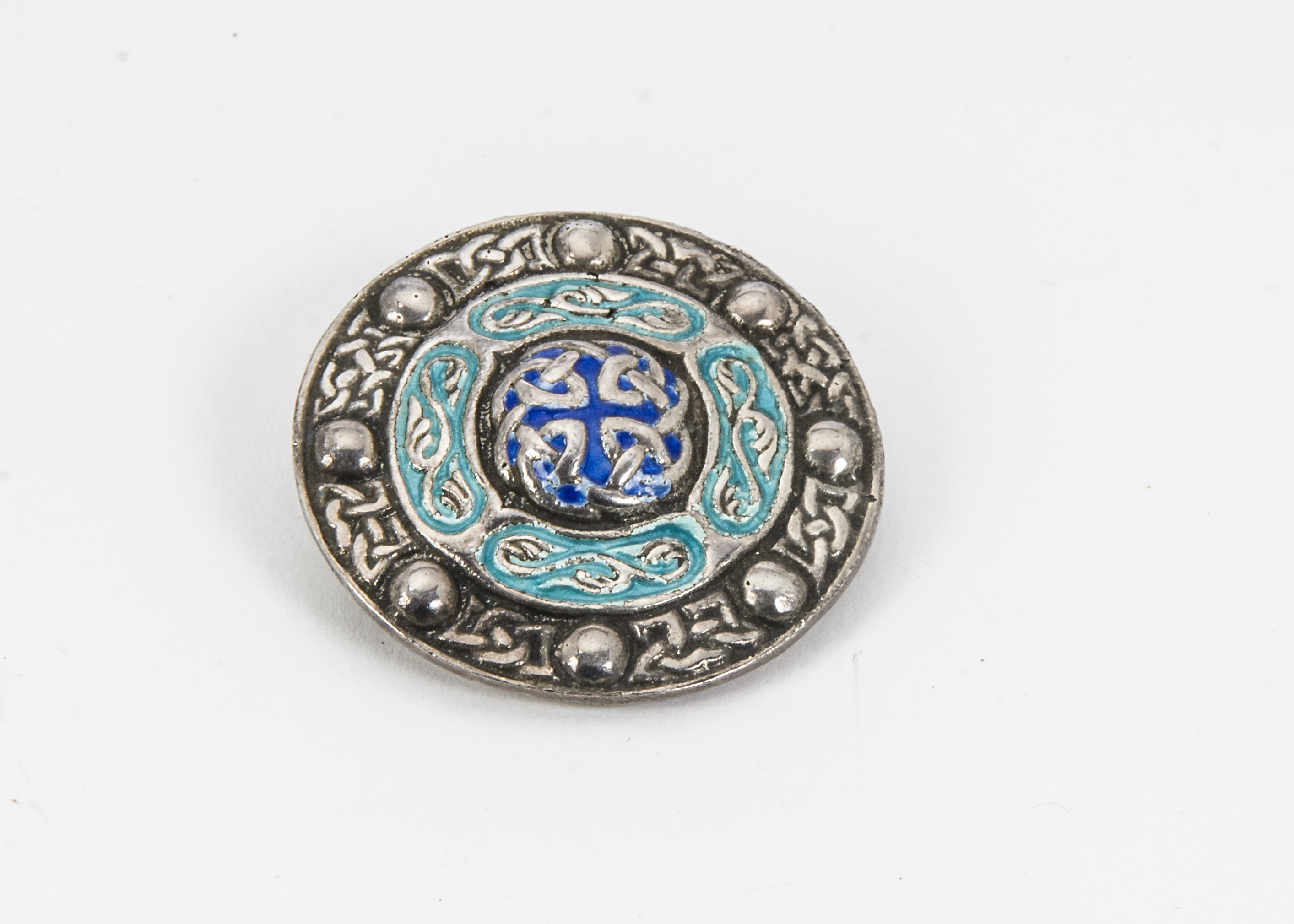 An early 20th Century silver and enamel brooch, shield shaped with Celtic motifs, Birmingham 1919 by