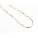 A vintage Middle Eastern yellow metal necklace, the high carat gold chain of oblong links with S