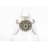 A 1970s 18ct white gold and diamond dress ring, the cluster with two concentric rings of small