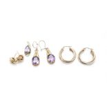 Two pairs of modern 9ct gold earrings, together with a pair of 9ct gold and purple stone earrings, a