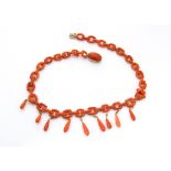 A 19th Century Italian coral and gold mounted fringe necklace, the oval chain links supporting