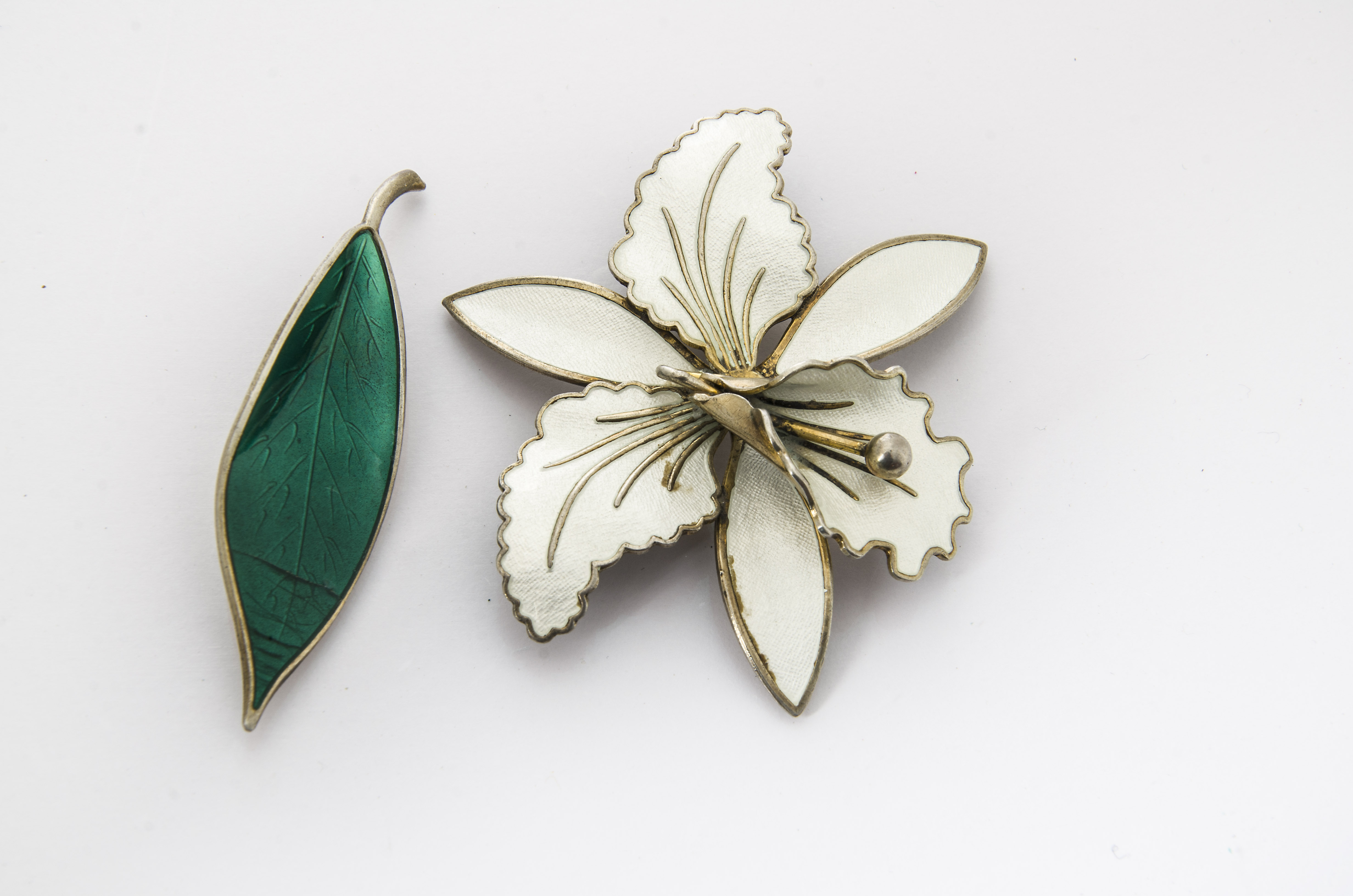 A David Andersen silver and enamel leaf brooch, (af) together with a Norwegian silver and enamel