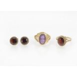 A 9ct gold and garnet ring and earrings, 5.4g, together with a gold and amethyst dress ring, 5.2g (