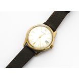 A 1970s Garrard automatic 9ct gold gentleman's wristwatch, 34mm case, satin dial with date aperture,