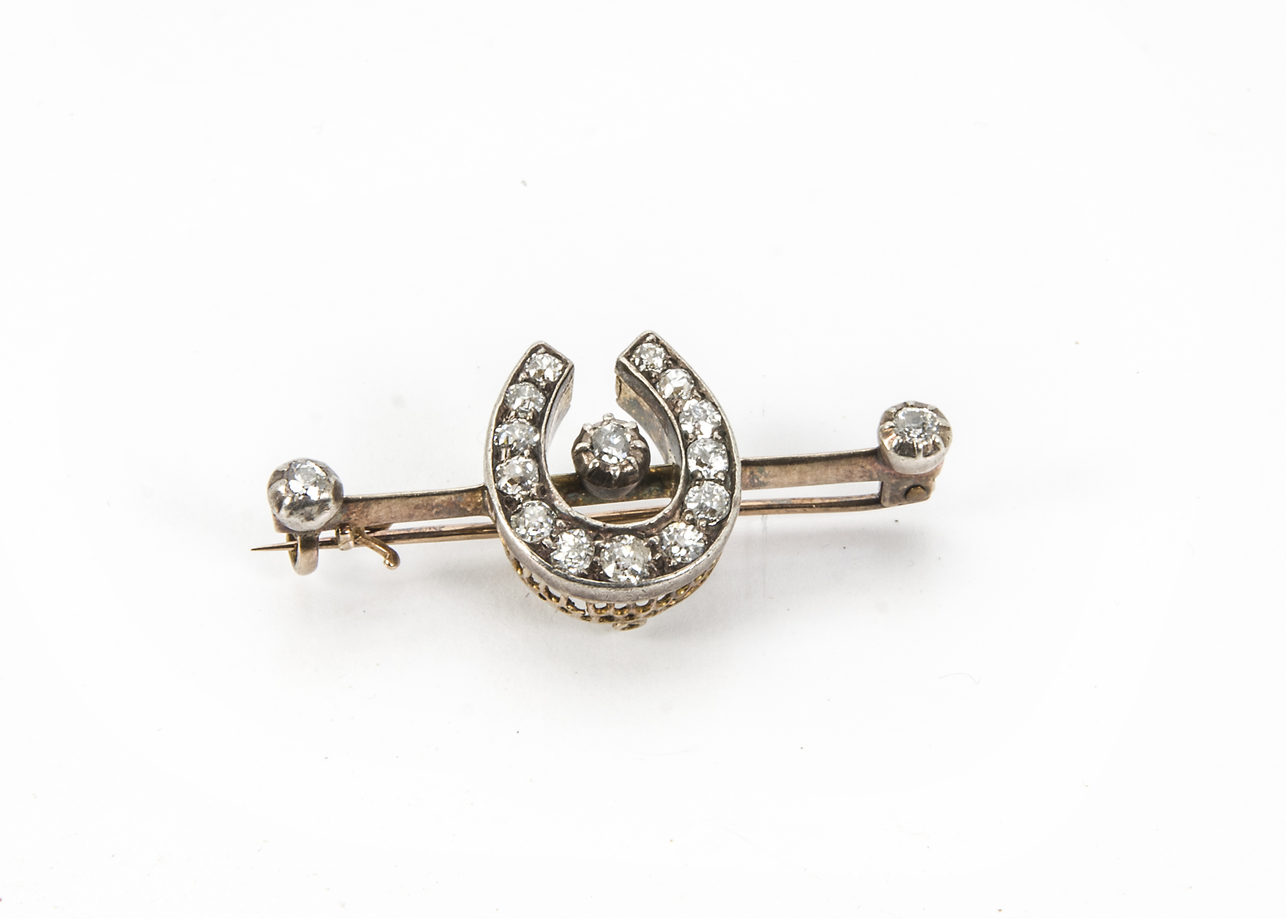 A Victorian diamond brooch, the silver and gold mount having old cut diamonds to the horseshoe and