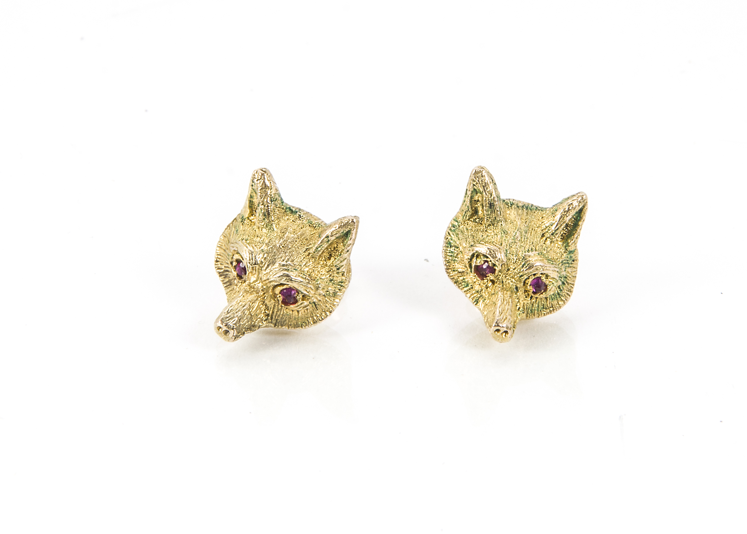 A pair of 1970s 9ct gold earrings, modelled as fox masks each with red stone eyes, 6.2g (2)